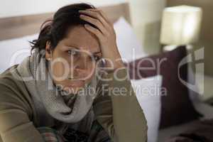 Woman suffering from fever and headache