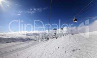 gondola and chair lift in nice sunny day.