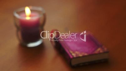 romantic book and candle rack focus