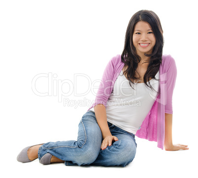 Asian woman sitting on floor
