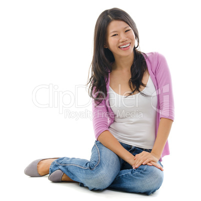Asian female sitting on floor