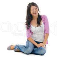 Asian female sitting on floor