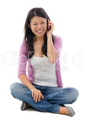 Asian woman talking on smart phone Asian woman talking on smart phone