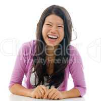 Candid Asian woman laughing