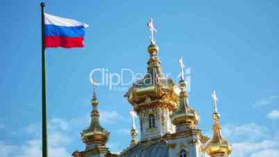 Domes of the church and Russian flag