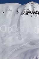 off piste slope with trace of skis, snowboarding and avalanche