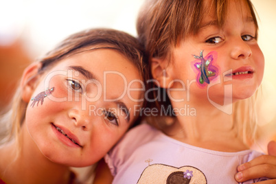 Cute Girls Showing Their Face Painting At A Party