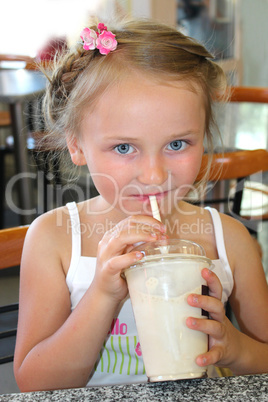 little beautiful girl drinking the cocktail in fastfood