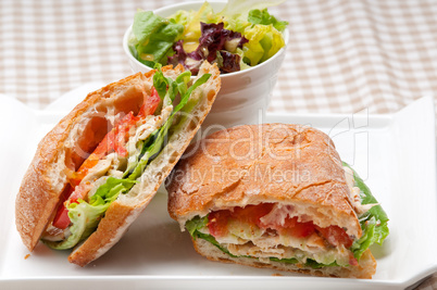 ciabatta panini sandwich with chicken and tomato