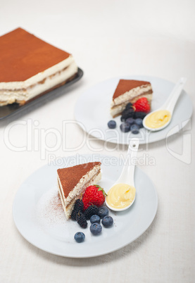 tiramisu dessert with berries and cream