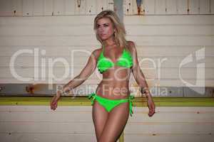 sexy beautiful blond in a green bikini