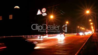 Timelapse of traffic on bridge at night