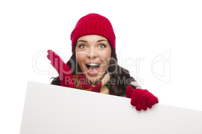 Surprised Girl Wearing Winter Hat and Gloves Holds Blank Sign