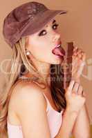 sensual woman licking a chocolate bar