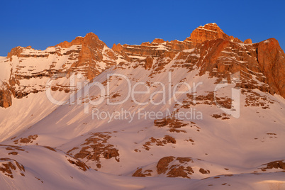 Sunrise in snowy mountains