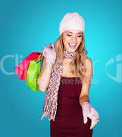 joyful young woman with shopping bags