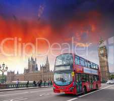London. Classic red double decker bus crossing Westminster Bridg