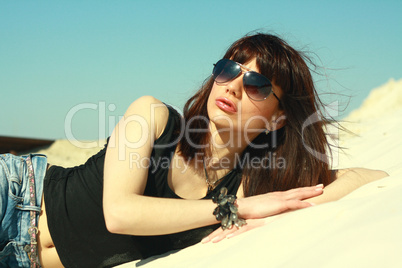 girl in black tanktop and spectacles on coast lake