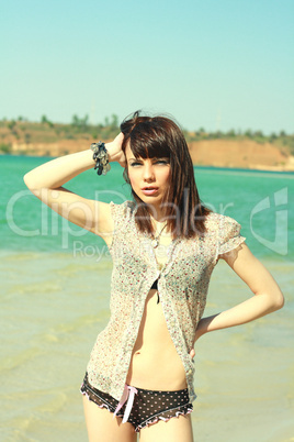 girl in shirt on beach