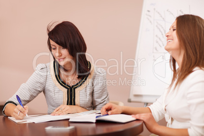 two female coworkers in a meeting