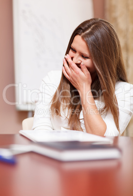 businesswoman laughing in a meeting