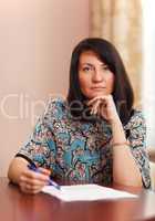 attractive middle-aged woman working at home