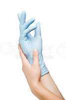 Woman hand putting on surgical glove