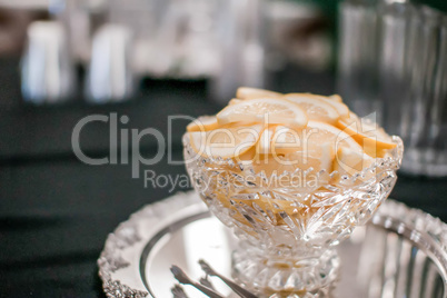 sliced lemon in a glass dish