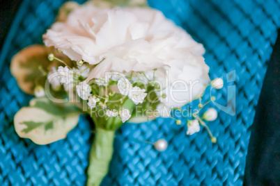 close up of a groom's buttonhole