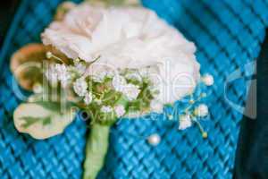 close up of a groom's buttonhole