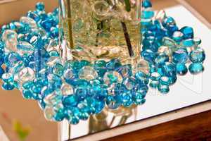 blue marbles on a reflective surface