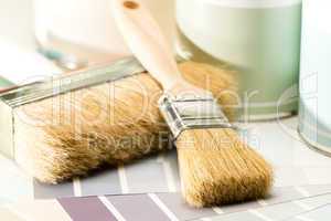 Painting supplies brush, can and swatch