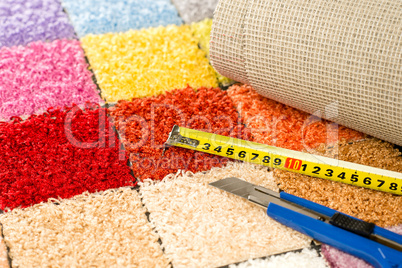 Carpeting knife, swatches and tape measure