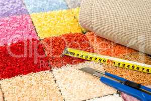 Carpeting knife, swatches and tape measure