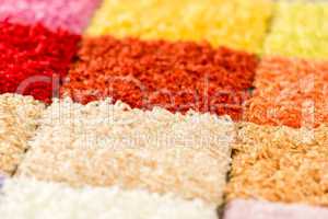 A variety of colorful carpet swatches
