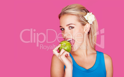 beautiful woman biting into an apple