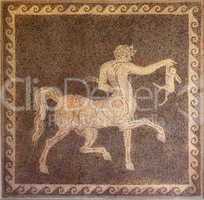 mosaic of centaur and rabbit on wall in the archaeological museum of rhodes greece.