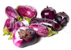 Different varieties of eggplant with water drops