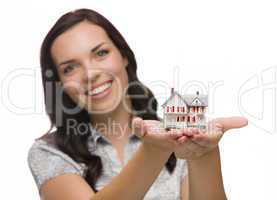 Happy Mixed Race Woman Holding Small House Isolated on White