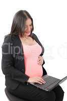 pregnant businesswoman working at laptop