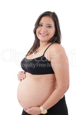 hispanic pregnant woman smiling and touching her belly