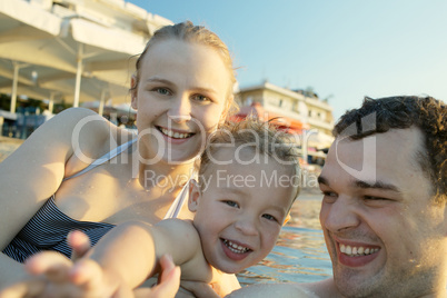 happy young family at the seaside