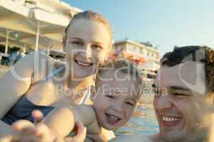 happy young family at the seaside