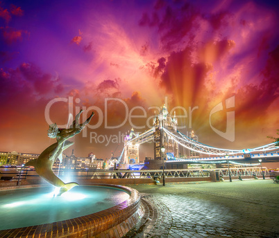 Tower Bridge and St Katharine Docks Girl with Dolphin fountain.