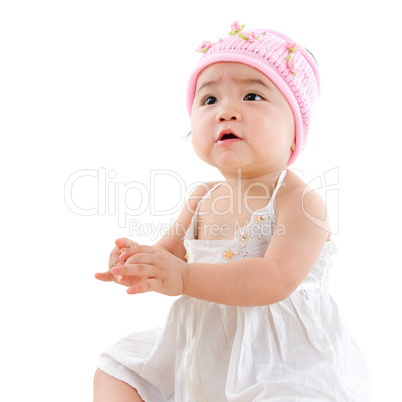 Asian baby girl looking up