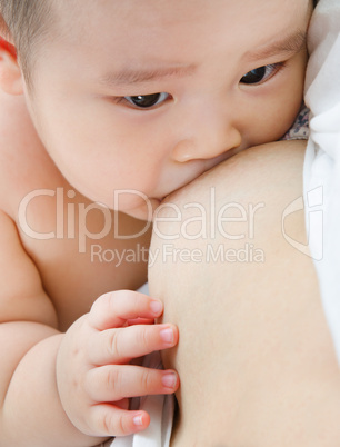 Mother breast feeding baby