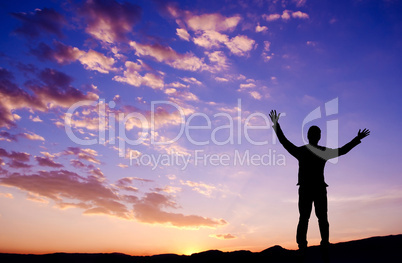 Freedom concept, businessman standing on top mountain