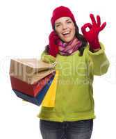Mixed Race Woman Holding Shopping Bags On Phone Ok Gesture.