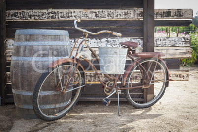 Old Rusty Antique Bicycle and Wine Barrel.