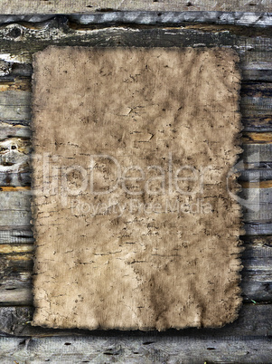 old sheet of parchment on a grungy wooden background